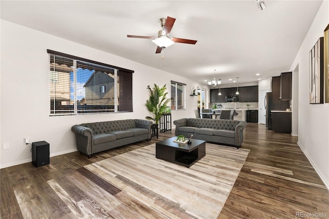 25127 E Maple Ave, Aurora, CO 80018 - living room featuring a chandelier, ceiling fan, dark wood-type flooring, baseboards, and recessed lighting