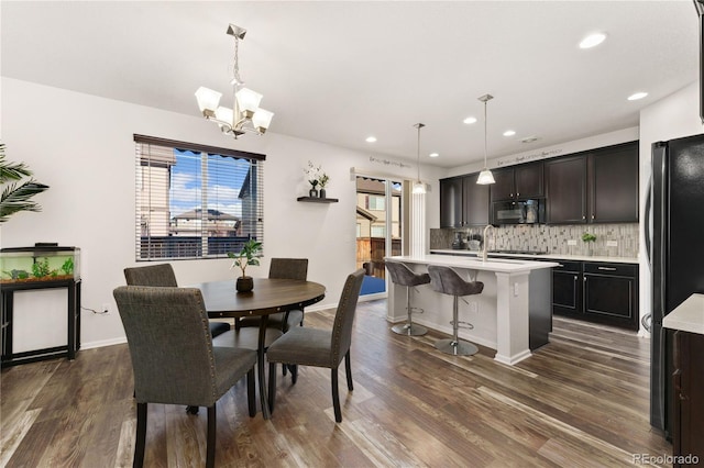 25127 E Maple Ave, Aurora, CO 80018 - dining space with dark wood-style flooring, recessed lighting, a chandelier, and baseboards