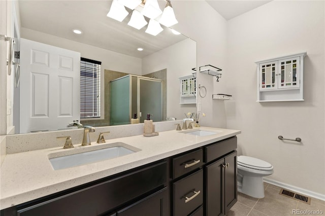 25127 E Maple Ave, Aurora, CO 80018 - full bathroom with double vanity, a stall shower, toilet, tile patterned floors, and baseboards