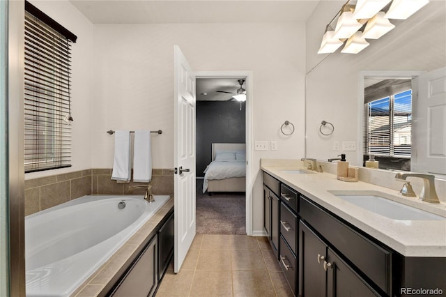 25127 E Maple Ave, Aurora, CO 80018 - ensuite bathroom with double vanity, tile patterned floors, a garden tub, and a ceiling fan