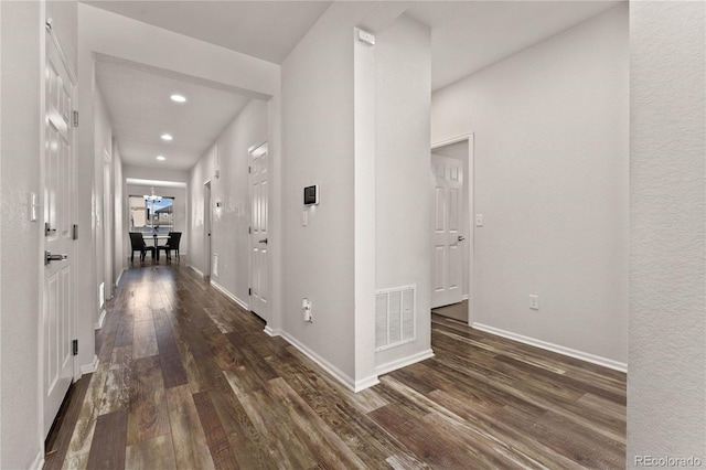 25127 E Maple Ave, Aurora, CO 80018 - hall with dark wood-style flooring, recessed lighting, and baseboards