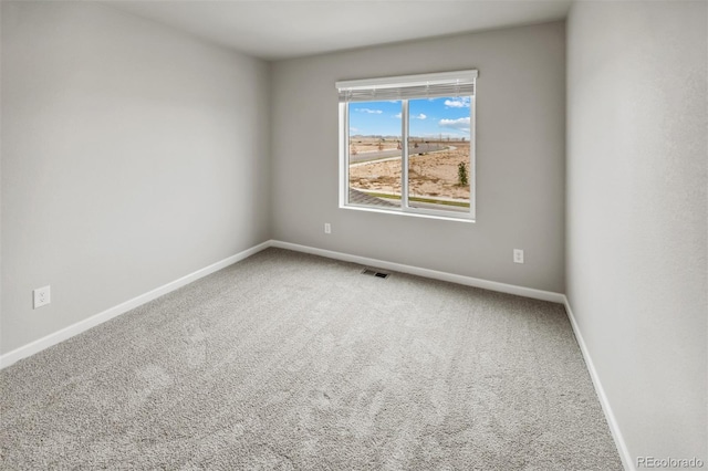 unfurnished room featuring carpet flooring