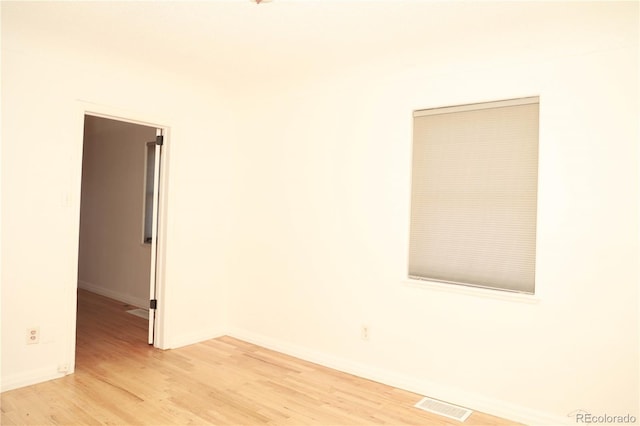 empty room with light hardwood / wood-style floors