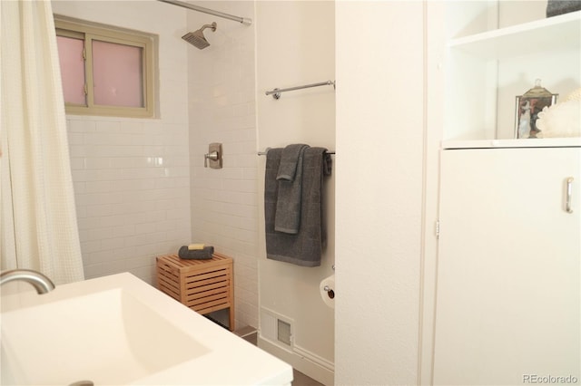 bathroom featuring walk in shower