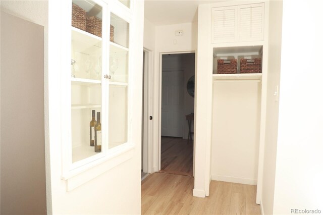 corridor featuring light hardwood / wood-style flooring