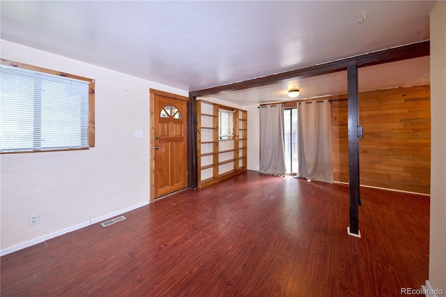 1703 W Weaver Ave, Littleton, CO 80120 - foyer entrance with wood finished floors, baseboards, and wooden walls