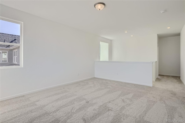 carpeted spare room with a wealth of natural light