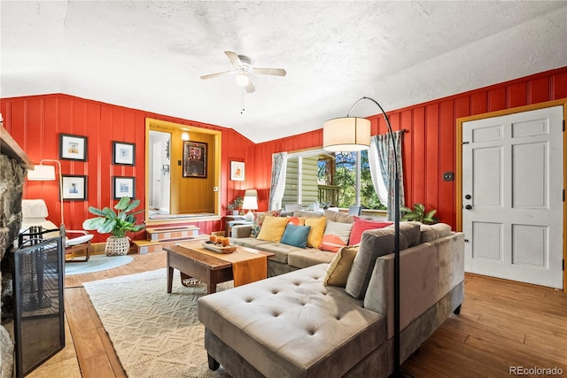 26351 Sheldon St, Kittredge, CO 80457 - living room featuring wood finished floors, a ceiling fan, and a textured ceiling