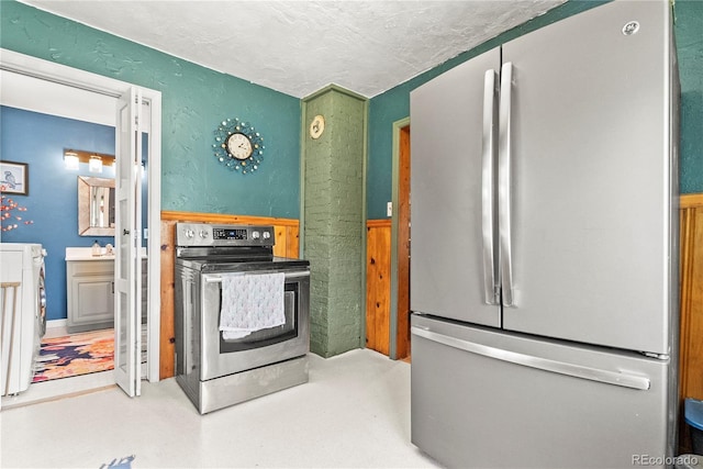 26351 Sheldon St, Kittredge, CO 80457 - kitchen featuring appliances with stainless steel finishes and a textured ceiling
