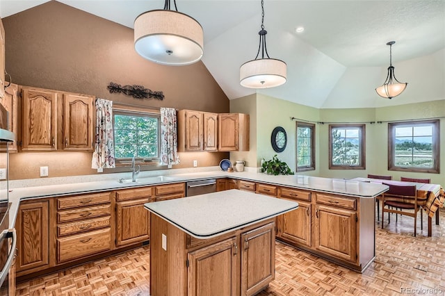 13837 W 59th Pl, Arvada, CO 80004 - kitchen featuring a peninsula, light countertops, a kitchen island, hanging light fixtures, and dishwasher