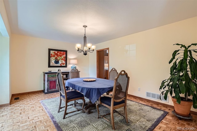 13837 W 59th Pl, Arvada, CO 80004 - dining area featuring a chandelier and baseboards