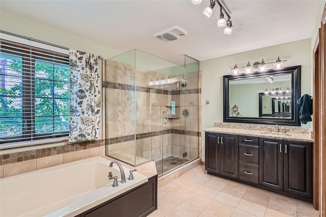 13837 W 59th Pl, Arvada, CO 80004 - bathroom with vanity, a bath, a stall shower, and tile patterned flooring
