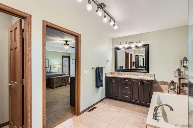 13837 W 59th Pl, Arvada, CO 80004 - ensuite bathroom with vanity, a bath, tile patterned floors, and ceiling fan