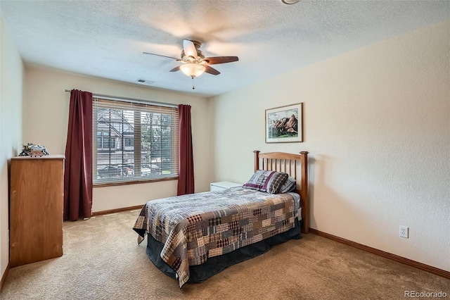13837 W 59th Pl, Arvada, CO 80004 - carpeted bedroom with a textured ceiling and a ceiling fan