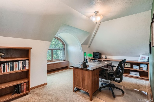 13837 W 59th Pl, Arvada, CO 80004 - office space featuring light colored carpet, vaulted ceiling, and a textured ceiling