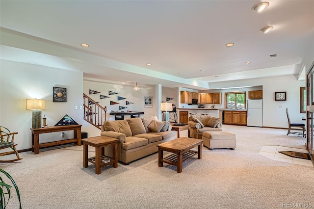 13837 W 59th Pl, Arvada, CO 80004 - living area featuring light carpet, stairs, and recessed lighting