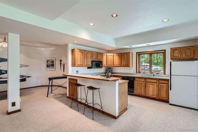 13837 W 59th Pl, Arvada, CO 80004 - kitchen with black appliances, light carpet, recessed lighting, a breakfast bar, and light countertops