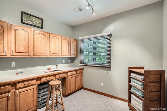 13837 W 59th Pl, Arvada, CO 80004 - home office featuring light colored carpet, built in study area, and rail lighting