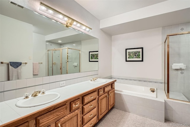 13837 W 59th Pl, Arvada, CO 80004 - bathroom featuring a shower stall, a bath, and double vanity