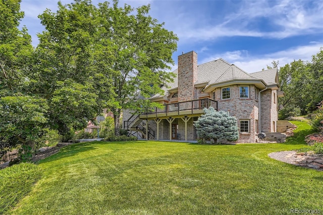 13837 W 59th Pl, Arvada, CO 80004 - back of property featuring stairs, a deck, a yard, and a chimney