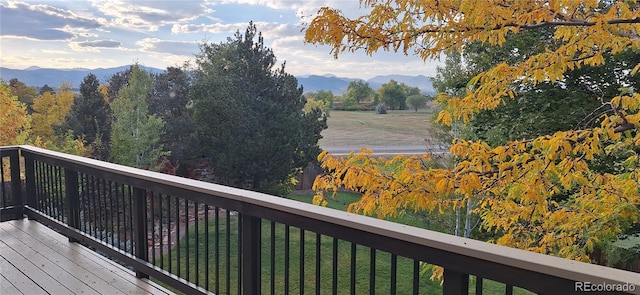 13837 W 59th Pl, Arvada, CO 80004 - wooden terrace with a mountain view and a lawn