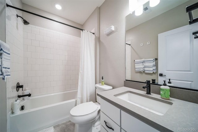full bathroom featuring shower / tub combo, toilet, and vanity