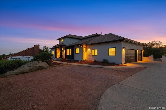 view of front of property with a garage