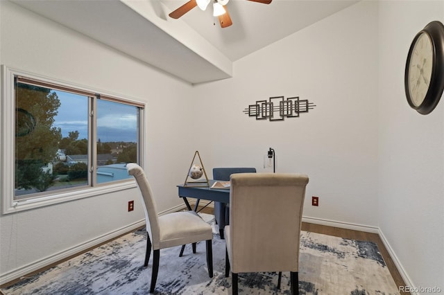 dining area featuring wood-type flooring and ceiling fan