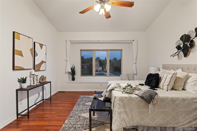 bedroom with lofted ceiling, ceiling fan, and dark hardwood / wood-style floors