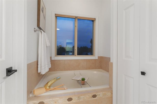 bathroom with tiled tub