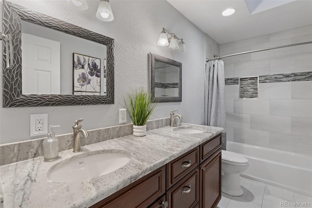 full bathroom with tile patterned floors, toilet, shower / bathtub combination with curtain, and vanity