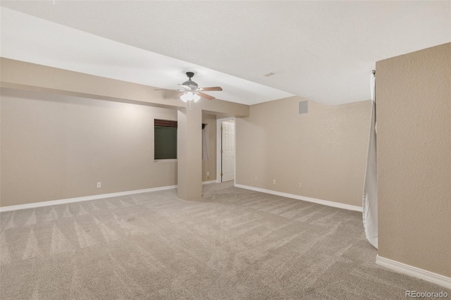 unfurnished room featuring light colored carpet and ceiling fan