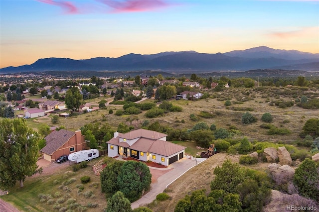 aerial view at dusk with a mountain view