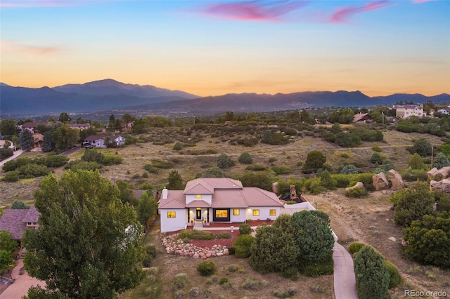 aerial view at dusk with a mountain view