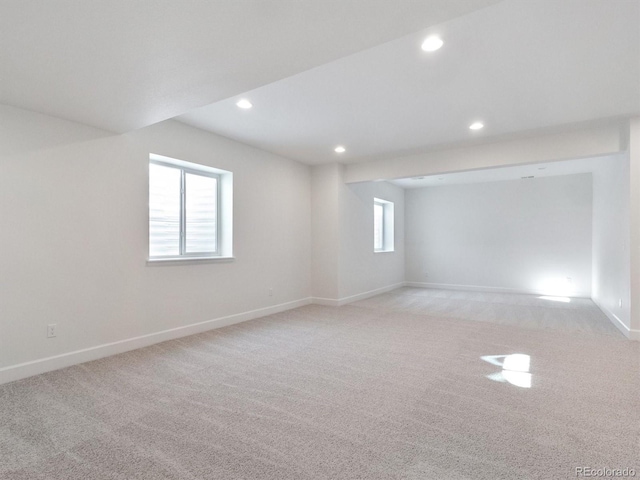 unfurnished room with light carpet