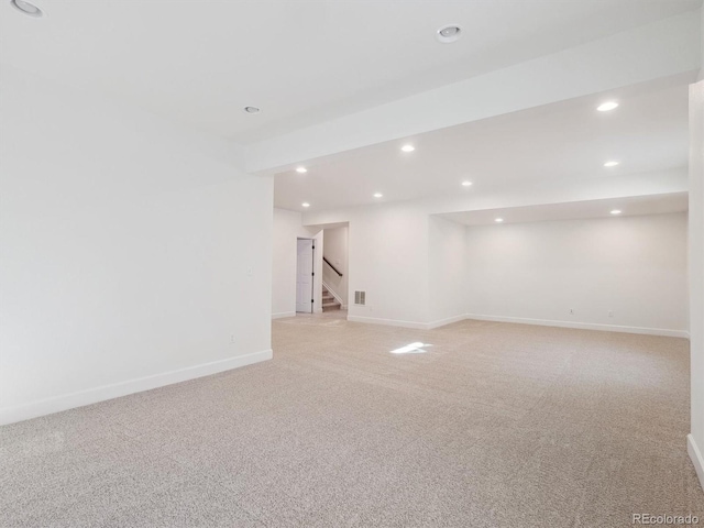 basement with light colored carpet