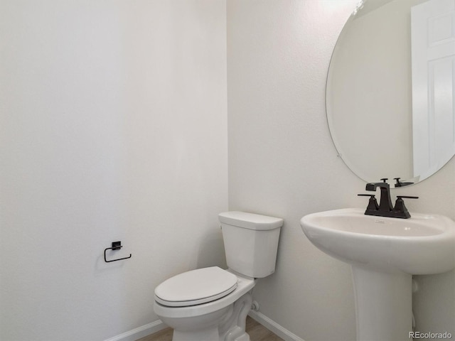 bathroom with sink and toilet