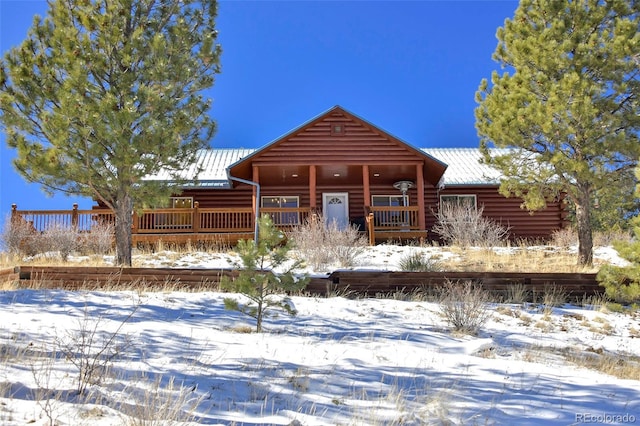 view of snow covered house