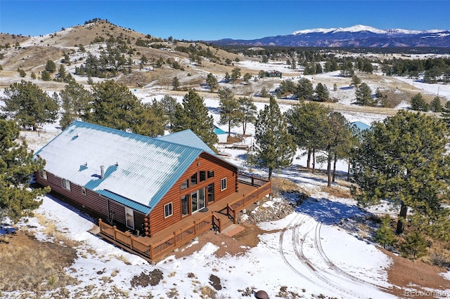 snowy aerial view with a mountain view