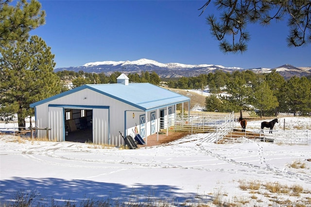 exterior space with a mountain view and an outdoor structure