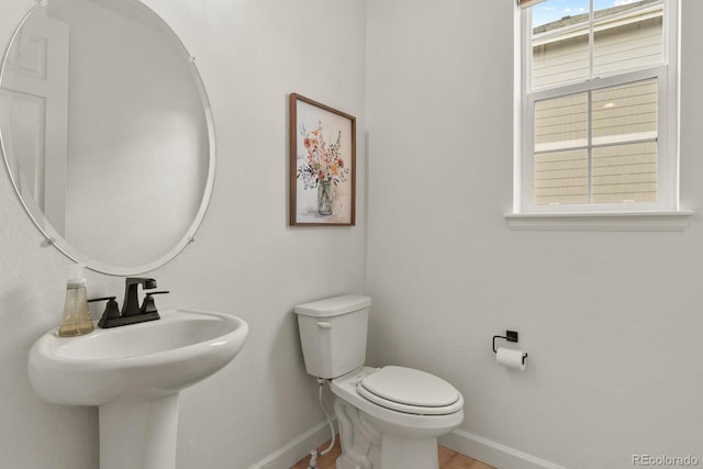 bathroom featuring sink and toilet