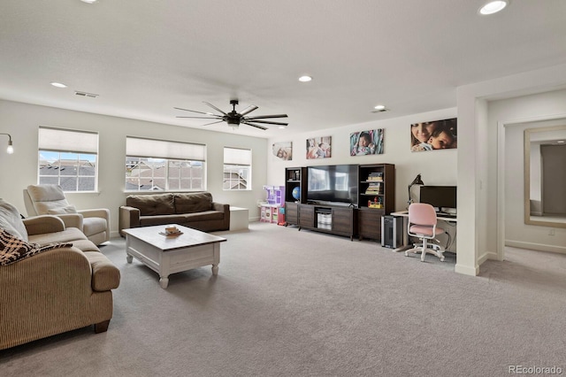 living room featuring light carpet and ceiling fan