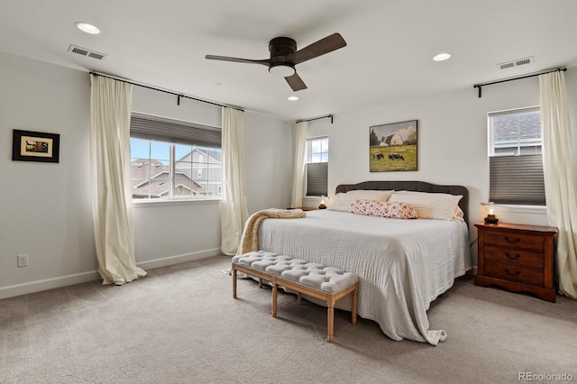 bedroom featuring ceiling fan and light carpet