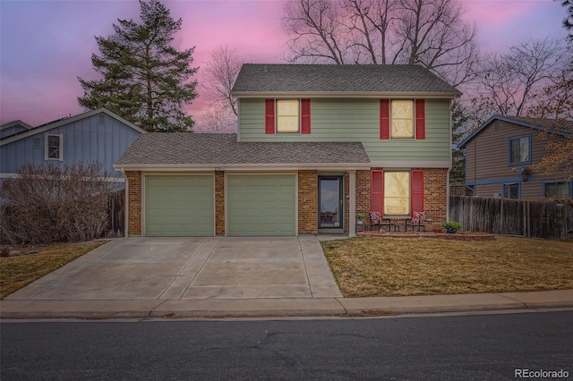 traditional home featuring brick siding, a shingled roof, concrete driveway, fence, and a garage