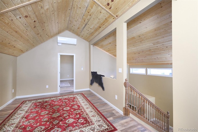 additional living space with lofted ceiling, wooden ceiling, baseboards, and wood finished floors