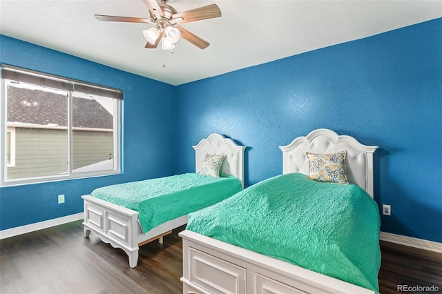 bedroom featuring dark wood-type flooring and ceiling fan