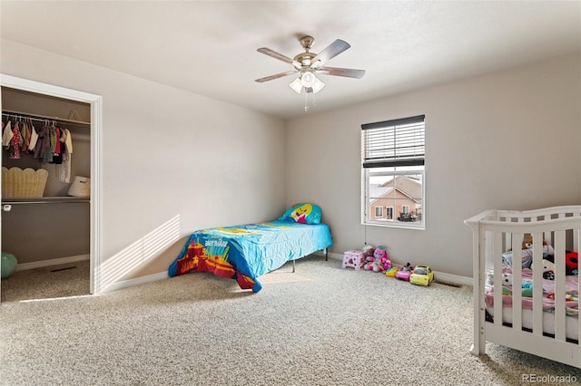 bedroom featuring carpet floors, a closet, and ceiling fan