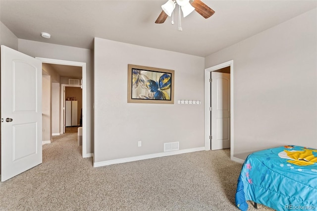 bedroom with ceiling fan and light colored carpet