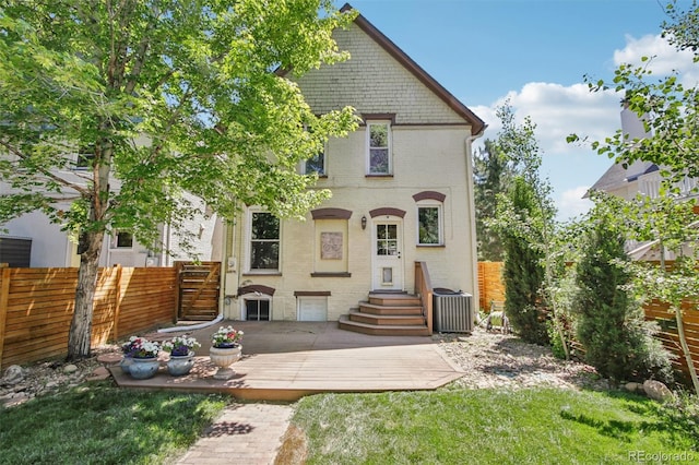 351 Bannock St, Denver, CO 80223 - rear view of house featuring brick siding and a deck
