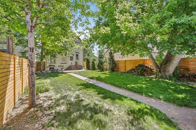 351 Bannock St, Denver, CO 80223 - fenced backyard featuring entry steps